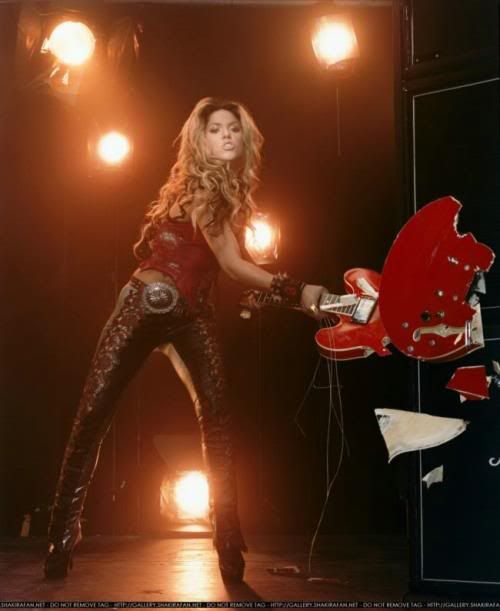   Musci and Shakira , shakira with guitar on stage for song 